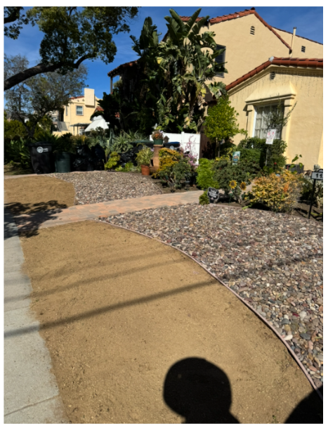 Clean front yard with fresh gravel and tidy walkway